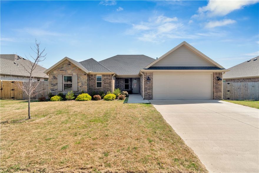 Located in a great neighborhood with a community pool and playground, this home offers convenient access to Hwy 412 and the upcoming 612 bypass for easier travel throughout NWA. The open floor plan includes a spacious living room with fireplace, large kitchen island, and dining area. There are four bedrooms, two bathrooms, a covered rear patio, and a large backyard suitable for outdoor activities, entertaining, or gardening. Schedule a visit to see if this could be your next home.