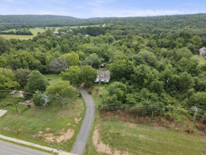 Historical home on approximately 9.9 acres on the edge of all of the potential commercial happenings of Russellville!