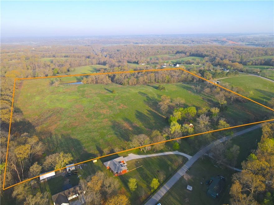 This gently rolling 40 acre property near Elm Springs is bursting with character, and poised for a multitude of development options.  From its quaint old homestead on the east side, venture west up the rise to discover a beautifully plateaued pasture, 2 ponds, and approximately 9 acres of gorgeous timber.  Maintain its rural, bedroom community feel with a small handful of large homesites, or take advantage its full potential and excellent location with more dense development.  This tract is positioned a comfortable 1/4 mile off the new 412 bypass, and just a convenient 3/4 mile from the new XNA Access interchange west of 612.  Electricity, water, and cable are at the road, and the investment opportunity is undeniable.  Call today for your private tour, and don’t miss the chance at this excellent slice of NWA ground.