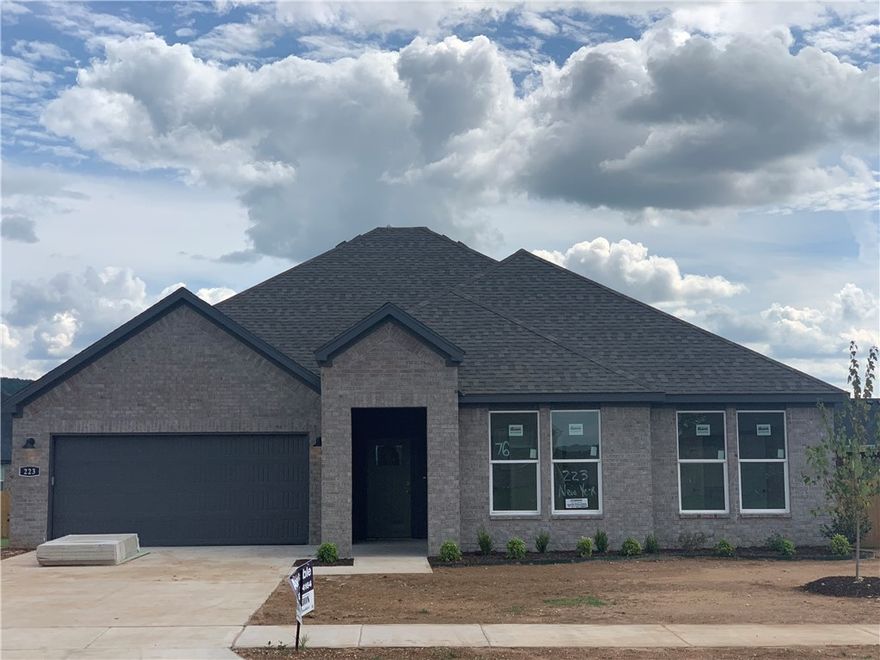 Come to the community model today! This +/- 1881 square foot DEAN plan is a fabulous floorplan with 4 Bedroom and 2 Bathrooms! Kitchen is open to the living room. This home boasts gorgeous quartz kitchen countertops, stainless steel appliances, cozy Electric fireplace with heater, and Luxury Vinyl plank flooring throughout!  Primary bath has an oversized shower, walk in closet and dual sinks with quartz countertops. Fans in all bedrooms as well as the living room!  This home exterior will have 4 sides brick! Covered patio and a landscape package. Garage Door opener! Tankless hot water heater! This home includes our HOME IS CONNECTED Smart Home package. Wagon Wheel Crossing. Make it home!