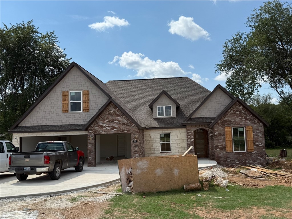 Wonderful floor plan on 1 acre lot with 3 bedrooms or a large 4th bedroom/bonus room. Large open spaces great for entertaining, installed security system, large master bathroom and closet connected to laundry room, nice big pantry. LVP floors in main areas of house, blinds and gutters included.