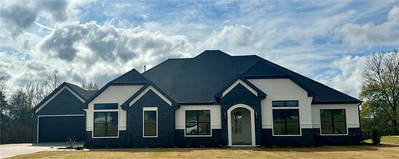 This is the Hailey plan. 4 Bedroom, 3.5 Bathroom and a 3 Car Garage! There is a bonus space off the foyer that can be used as a formal dining/ study. Luxurious Bedroom One with a fabulous en suite bathroom with a Walk-in Shower and Soaking Tub. Kitchen boasts cabinet to ceiling cabinets, quartz counters, farmhouse sink and Kitchen Aid Stainless Steel Appliances with double ovens! Black fixtures! LED Lighting! Ceiling fans!! Mix of Brick and Hardie board exterior per plan. Asher's Ranch is an idyllic community nestled in the heart of Goshen, Arkansas, known for its picturesque landscapes and serene surroundings. The community boasts meticulously designed and built homes that are situated on expansive lots, with ample space for outdoor activities, gardening, and privacy. The homes are crafted to perfection, featuring modern amenities and elegant finishes that exude luxury and comfort. Come to Asher's Ranch and find your dream home today! Taxes TBD.