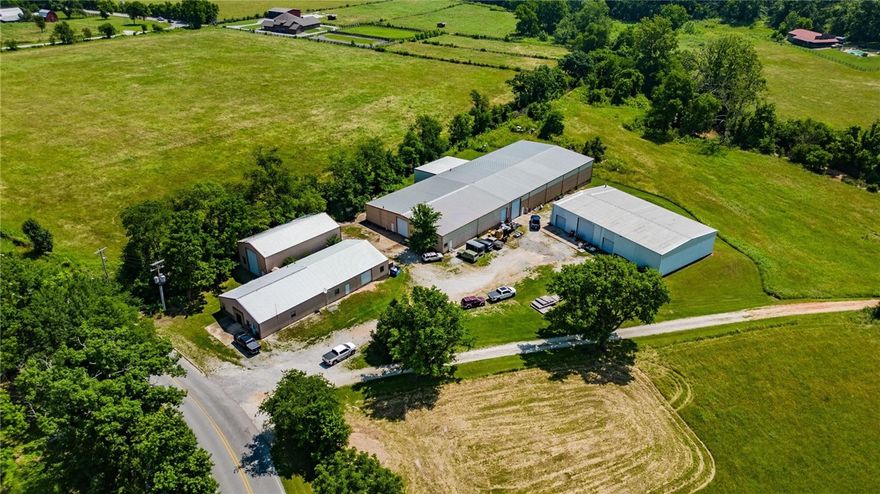Unlock the full potential of your business with this multi-building industrial manufacturing facility in north Bentonville! Whether you're expanding an operation or looking to establish a highly functional base for production, this property offers the space, flexibility, & location to meet your needs. Large bays provide an ideal layout for equipment, heavy operations, or multi-department setup. Clear span interiors with high ceilings accommodate large equipment & vertical storage needs. Multiple overhead & dock doors offer convenient access for loading and unloading. Can handle high-capacity industrial power demands. Ceiling suspended utility lines support efficient operation of CNC machines, hydraulic presses, and more. 6-8" thick concrete floors ensure durability for heavy machinery such as forklifts, presses, mills, and lathes. A dedicated front area with private offices & conference room, that can be customized for administration or design/engineering needs. Close proximity to I-49 & Coler Mountain.