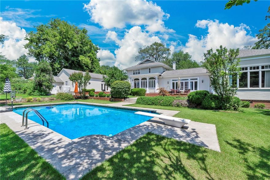 Welcome to this private & secluded estate with 6 bedrooms/4.5 bathrooms total with 5 bedrooms/3.5 bathrooms being in the main home.  The estate is nestled on approx 2.5 acres w/approx 6400 sq feet on the historic & prestigious Free Ferry Road!  Latest appraisal was $946,000!  The guest house is a great option for rental or Airbnb!  The home is ideal for entertaining w/expansive & open living areas, dining,  sunroom, back patio & pool all conveniently located near the kitchen.  The gunite pool overlooks the expansive backyard. The kitchen consists of extras including ice maker, trash compactor, butler’s pantry w/ wine bar & wine refrigerator.  The primary suite consists of a very spacious bedroom, bathroom w/jetted tub, open shower, toilet closet, exercise area, walk in closet, main level laundry room w/ a desk area.  The office is ideal for those who work from home & has a guest bath & access to the garage via the breezeway.  Upstairs there are four guest bedrooms & two full bathrooms. Call to see this great estate
