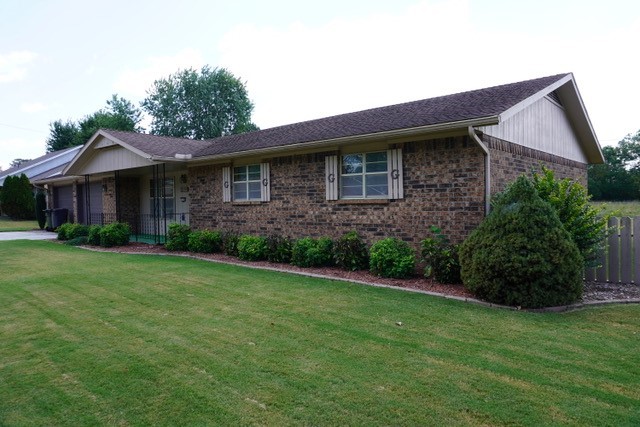 One owner all brick home, 3-2-2, extra large garage, workshop/storage building in backyard with electric, 24x16. Large living room with wood burning heatolator fireplace, china hutch is built in. Home sits in the heart of Rogers in a quiet neighborhood, close to schools. It's ready for a new owner.