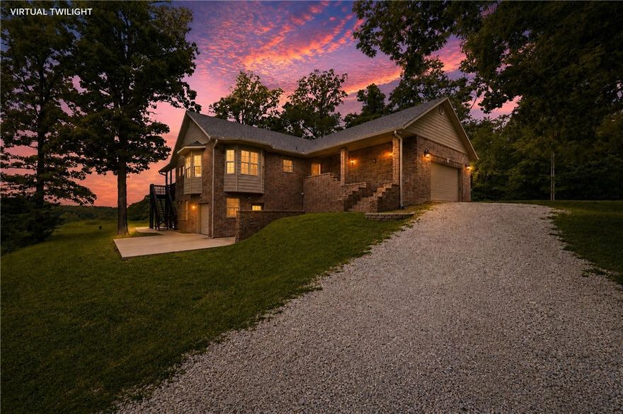 Acreage, views, Bentonville Schools, and rare flexibility make this Bella Vista property one you don’t see every day. Sitting on 3.17 total acres and not part of the POA, this home offers a rare Bella Vista setting without the typical POA restrictions. Inside, the craftsmanship stands out with hickory cabinets, white pine ceilings and baseboards, detailed woodwork, and two wood-burning fireplaces. The walkout basement adds even more versatility with a bedroom, full bath, large second living area, epoxy-coated concrete floors, extra storage, and a completely separate lower-level garage/workshop area. With its own garage door access and electrical hookups, this space is ideal for bikes, tools, EV charging, or hobby projects. Recent updates include a 2024 roof, 2025 double oven and gas cooktop, and well-water filtration system. The subdivided parcel has its own address and electric meter, creating future possibilities — buyer to verify permitted uses.  See attached features sheet for additional details.