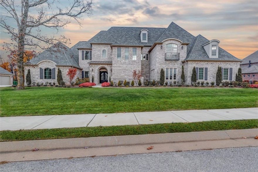 5,772sf home offers 5 bedrooms and 4.5 baths embraced in a European flair featuring Juliet balconies, front courtyard, brick eyebrow arches, & double iron doors for the entry. 3-Story living room, beautiful windows, double sliding doors to the exterior covered patio. Double sided, cast stone fireplace, is flanked w/built-ins Stunning library/study. Kitchen comprises hidden outlets, upgraded appliances, & stunning finishes. Master suite offers a sitting area, beautiful marble counter tops, double closets w/built ins, & exquisite architectural detail. Full theater with concession/bar space, huge loft area w/wood floors, mud room w/storage/ cell phone charging station, butler's pantry w/back-lit cabinetry and beverage fridge. No detail left out and many custom features! Must SEE!