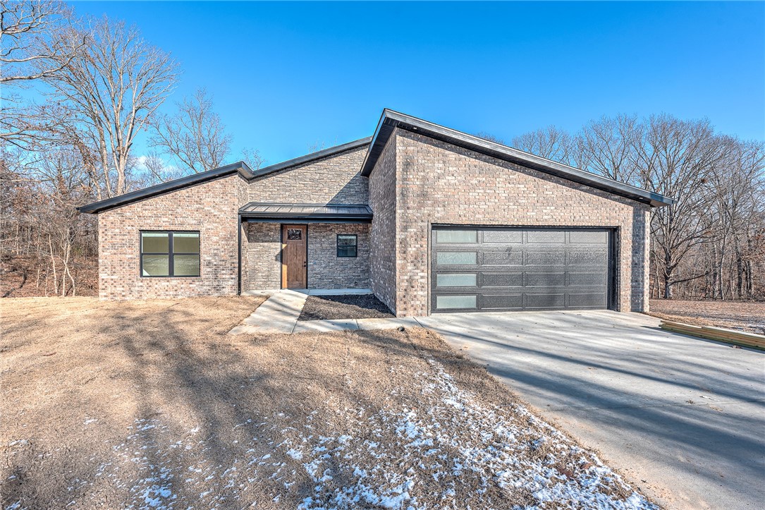 Just getting the final touches on this modern fell new construction home. You will love the curb appeal of this along with the open floor plan inside and the amenities such as LVP Flooring, Tile Flooring in the Bathrooms, Tile Master Shower, Quartz Countertops, Built in Drop Zone Off of garage, Accent Wall in the Master bedroom, Gas Log Fireplace in the living room to enjoy on these snowy days. This is set up as a 2 Bedroom home septic system and has a room designated as an office.
