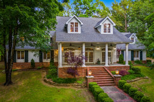 Sellers aren't leaving Harrison---just downsizing! This Executive home sits on 3.71 beautiful acres right in Harrison. A safe walk to schools, the Arts Center and Bakers Prairie, this home's location has so much to offer! This two story home with full finished basement features hardwood floors, two laundry rooms, full basement kitchen, gas and wood fireplaces, homework/study room with built in desks and storage, dual HVAC systems, storm shelter/safe room, barn, potting shed, screened in porch, outdoor entertaining space, sprinkler system, garden, a chicken pen/hen house and over 20 species of trees on the property. Please refer to Supplement sheet for entire list of extras. Call today for an appointment!