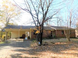This charming home in Bayou Ridge Estates is not lacking in charm or living space! A lovely 3BR 2BA home with two car carport on 5 acres with a spacious deck and outbuilding. The walkout basement workshop won't disappoint either! Carport has locked storage and safe. If you want a little privacy close to town, this could be the one!