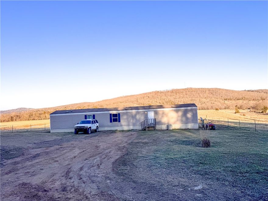 Welcome to this well-maintained 2017 mobile home offering comfort, efficiency, and a peaceful setting just outside Huntsville, Arkansas. With 1,064 sq ft (14x76), this 3-bedroom, 2-bath home provides a functional layout ideal for families, first-time buyers, or those seeking a low-maintenance lifestyle. Situated on approximately 0.6± acres, the property offers ample outdoor space for gardening, pets, or relaxing evenings. Enjoy the beauty of the Ozarks with War Eagle Creek nearby, known for its scenic views, floating, and outdoor recreation. Conveniently located within easy driving distance of Northwest Arkansas amenities, shopping, dining, and employment opportunities, this property combines affordability, location, and lifestyle. Whether you're looking for a primary residence or investment opportunity, this home delivers value and versatility in a growing area.