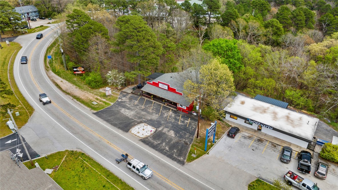 Tucked away in the enchanting hills of Northwest Arkansas, this attractive 3,800 sq. ft. building zoned for commercial & residential applications offers the perfect opportunity to create a premiere hotel or short term rental with major highway frontage located just minutes from the historic downtown Eureka Springs! The lower level is already established as a 3 bedroom residence that could easily sleep 8 guests while the upper level offers you the opportunity to double your business.
Your guests will be within easy reach of the townās unique boutiques, art galleries, & delicious dining options. They will enjoy outdoor adventures with nearby hiking trails, scenic drives, & access to Beaver Lake for water activities.
Become the go-to spot for a weekend getaway, a special celebration, or a quiet retreat, in this exceptional location by offering all the amenities and comforts your guests could need for an unforgettable stay in one of Arkansasā most charming destinations.
Also listed as residential MLS# 1305297