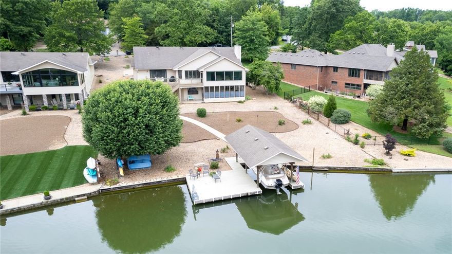 Gorgeous, flat, no maintenance yard, lake front, Loch Lomond home in Bella Vista! The wall of windows will draw you immediatly to the beautiful, breath-taking, panoramic views of the water! Complete with a your own boat/swim dock to lounge, easy access to throw your board on the water, or take the boat out for a evening ride! Inside you'll find a split floor plan for privacy. 3 bedrooms and 2 fully remodeled baths upstairs and 1 bedroom and 1 full bath downstairs. Open living, kitchen and dining area with windows galore allows you to take in all the beauty the lake has to offer, including those GORGEOUS sunrises!