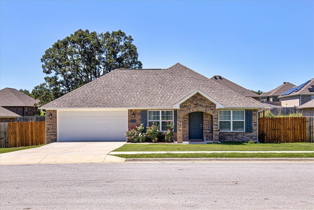 Newly built beauty in Gentry! This 1589 sqft home offers 4 beds and 2 baths. Revel in wood laminate floors throughout, accentuating style and easy maintenance. The fenced backyard and light landscaping enhance outdoor living. A spacious primary bedroom boasts a private bath and walk-in closet. The kitchen showcases dark-stained cabinets for convenience, a glass range, and elegant granite counters. Enjoy modern comfort and style in this splendid abode.