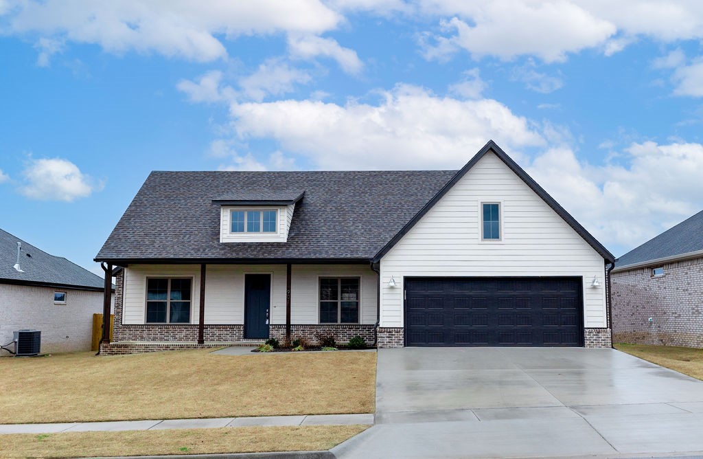 Nestled in Prairie Grove's Mountain View Estates, close to schools, shopping and the historic Prairie Grove Battlefield Park. This 3BR/2.5BA - 1,793 SF home blends elegance with functionality all on one open level. The living room gives cozy vibes with a gas fireplace, while the luxury vinyl plank flooring throughout makes maintenance easy. A luxurious primary suite includes a bathroom that will make you feel like you are at a spa. There is a large, welcoming covered front porch and huge covered back deck that is perfect for entertaining. Schedule your showing today!