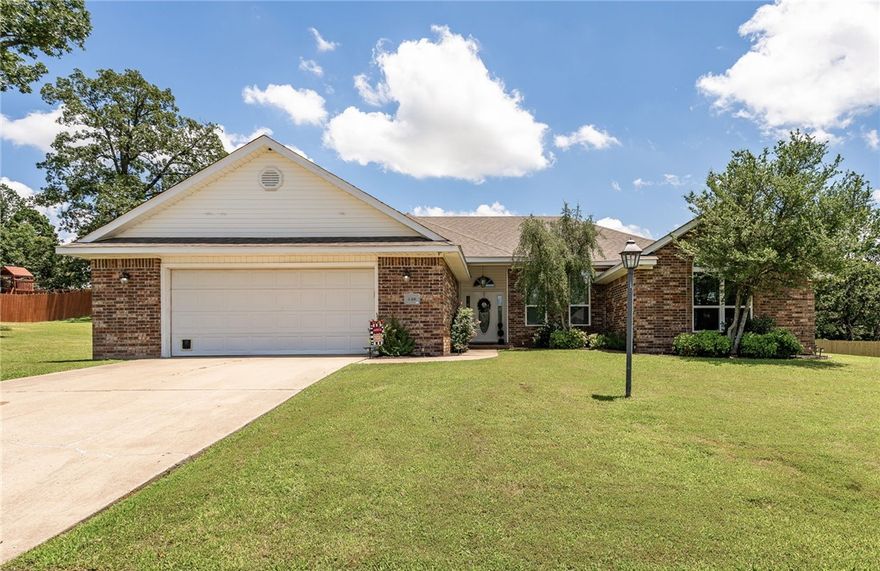 Move-in ready brick home on nearly an acre (two lots) just East of Alma. Recently remodeled kitchen with quartz countertops, large under mount sink, stainless steel appliances, fresh paint and a large walk-in pantry. Some new light fixtures and ceiling fans. Hot water heater is less than a year old. Spacious rooms throughout, including walk-in closets and lots of storage space. Roof on the home is approximately 2 years old. Separate oversized 2 car garage/shop with electric and a/c unit. Walking distance to River Valley Golf.