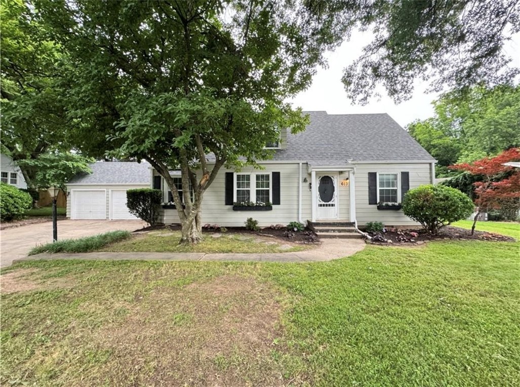 Welcome to this charming 3-bedroom, 2-bathroom house right off the Razorback Greenway. Nicely updated 1940's home located just minutes from the heart of the Springdale Downtown district. Inside the home you are met with hardwood floors, and a large kitchen that is fully equipped. Stairs off the dining space lead up to bedroom 3, bonus space and a full bathroom. Fully fenced back yard for privacy. Oversized covered back porch with an outdoor ceiling fan, perfect for entertaining. Washer & Dryer is provided. Come take a look!