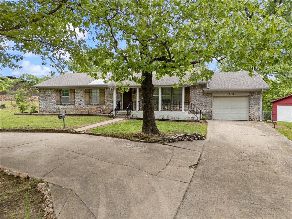 Concealed at the end of a quiet cul-de-sac and gently hugged by a luscious tree-lined backyard, this home offers just the right balance of neighborhood charm and outdoorsy experience. Enjoy your morning cup of joe on a lovely covered front porch overlooking a thoughtfully landscaped front-yard. You could even wind down on this property's sizeable back patio which would be opportune for evening grilling or cozy bonfires. The interior features updates to both bathrooms in addition to carpet that is approximately 2 years old exclusively located in all 3 bedrooms. The detached outbuilding provides the space to finally dive into that woodworking or welding project you've been talking about for months. This space also provides plenty of storage to house all your outdoor gear and tools.
**Refrigerator, dishwasher, double oven, stovetop, washer, and dryer to convey at no additional cost**