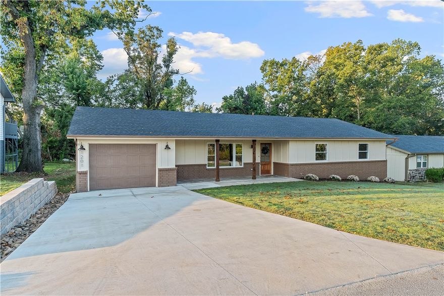 Stylishly updated & in a prime Bentonville location, this home offers an open-concept layout designed for modern living. The bright kitchen features a spacious island, large pantry, & great flow into the living & dining areas. A heated & cooled sunroom adds year-round usable space perfect for an office or second lounge area. Step outside to a brand-new deck overlooking the private backyard, ideal for entertaining.  Located minutes from Downtown Bentonville, Crystal Bridges, parks, schools, and trail access, this property delivers convenience, comfort, and style in one of NWA’s most desirable areas. Recent upgrades include a 1 year old roof & recently installed HVAC & mini split system, giving you peace of mind for years to come. Don’t miss this opportunity to own a move-in-ready home with a prime location giving easy access to world-class dining, shopping, Mountain bike trails, & all that Bentonville has to offer! *New driveway will fit 2 vehicles beside each other - 4 Vehicles total can fit in the driveway.*