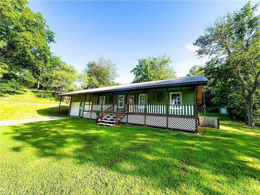 Charming 3-bedroom, 3-bath home nestled just outside Green Forest, AR, offering privacy, peace, and a natural setting that backs up to Yocum Creek.

Tucked off the main road, this property provides a serene atmosphere with the convenience of being just minutes from town. Inside, you’ll find oak flooring, built-in cabinets, and custom shelving throughout. The home is equipped with central propane heat, an attic fan, a new tankless water heater, and a new dishwasher.

Additional features include: Detached 8x10 storage shed, metal roof, & a screened-in back porch. 
Whether you’re searching for a full-time residence or a weekend retreat, this property offers a perfect blend of comfort, charm, and natural beauty.