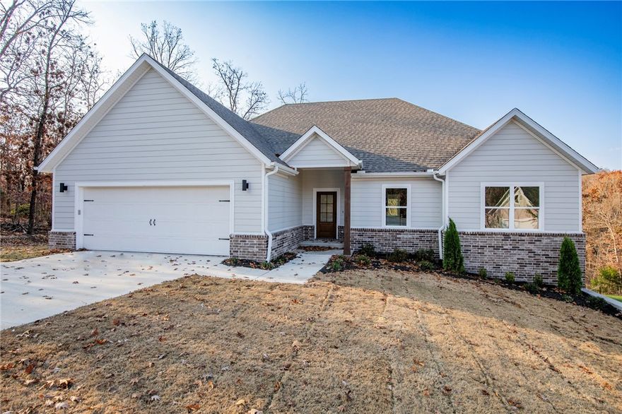 Stunning New Construction in Scenic Bella Vista
Welcome to this beautifully designed new construction home, nestled in the heart of Bella Vista. Featuring a modern open floor plan, high-end finishes, and exceptional craftsmanship throughout, this home is built for both style and functionality.

The spacious living area centers around a sleek fireplace, offering a warm and inviting space to relax or entertain. The chef-inspired kitchen is equipped with premium appliances, elegant countertops, and generous cabinetry—ideal for cooking and gathering.

Retreat to the luxurious primary suite, complete with a spa-like en-suite bathroom and thoughtful design touches. Additional bedrooms provide flexible space for guests, a home office, or a growing household.

Don’t miss this opportunity to own a move-in-ready home that blends comfort, elegance, and convenience in one of Bella Vista’s most desirable communities. WELCOME HOME!