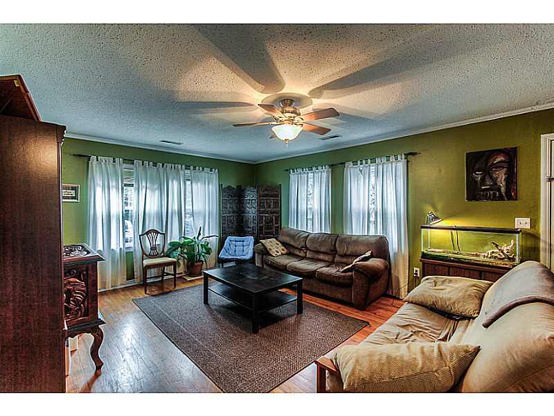 PERFECT STARTER HOME! Charming 4BD/1.75 bath home in E. Fayetteville. .75 acre with 4 car detached garage (Man Cave Paradise OR Mechanic's Garage) Home updates include: kitchen and vinyl windows throughout.,This home will not be on MLS long, so call today for your showing.