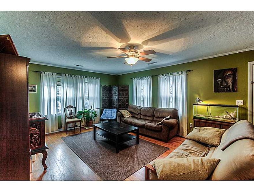 PERFECT STARTER HOME!  Charming 4BD/1.75 bath home in E. Fayetteville. .75 acre with 4 car detached garage (Man Cave Paradise OR Mechanic's Garage)  Home updates include: kitchen and vinyl windows throughout.,This home will not be on MLS long, so call today for your showing.