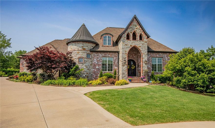 Tucked away on a quiet cul-de-sac inside a flourishing Rogers subdivision sits this luxurious, one-of-a-kind home. The huge floor plan clocks in at an astounding 6,070 sq. ft., well-appointed over two levels. The ground floor has a mother-in-law suite, office, intercom system, surround sound, primary suite with a clawfoot tub, walk-in shower, walk-in closet, formal dining area, gourmet kitchen with a wine bar, double ovens, two islands, & gas-convertible stove, a covered balcony, a laundry room with storage & sink, a mud room with even more storage, and a huge 3-car side entry garage. Down a grand staircase is a theater room, a game room, a kitchenette, four bedrooms, a bar area, a storm shelter, secret storage under stairs, a second office/storage room with additional washer/dryer hookup, & a covered, screened-in patio. Your own personal palace sits on 0.46 acres surrounded by mature trees for an added sense of privacy. Pet parents, don't worry - an invisible fence surrounds the property. Schedule your tour today!