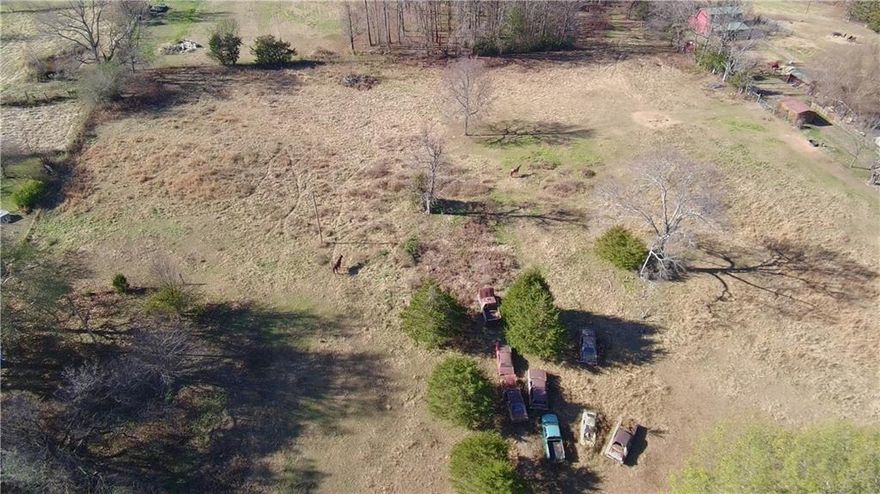 Beautiful 5.00 +/- acres of pasture land currently used as a small horse farm, located just outside the Russellville city limits in the highly sought-after Pottsville School District. Conveniently positioned near Russellville, Dardanelle, and Pottsville, this property offers the perfect balance of country living with quick access to town.  All utilities are at the street, making it ready for your dream home or farm setup. If you’re looking for peaceful country living just minutes from downtown Russellville and downtown Dardanelle, this is truly one of the best locations on the market.