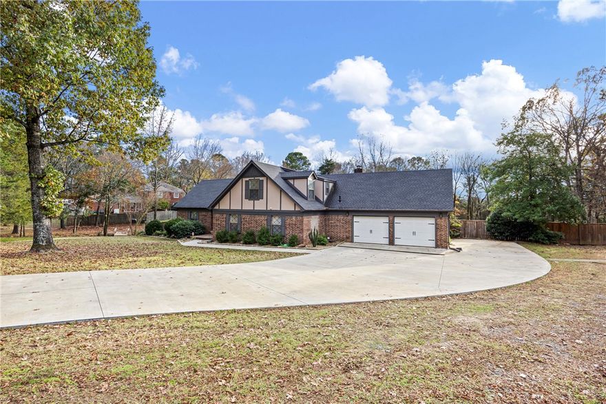Welcome to 1424 Lands End Point North, a warm and inviting home set on 1.6 acres m/l in one of Russellville's most popular neighborhoods off Skyline. Sunlight fills the open kitchen and living area, creating a bright, uplifting space perfect for everyday life and gatherings. The main level includes a primary bedroom with a large walk in closet, built ins and an en suite bathroom. A laundry chute adds everyday convenience for those with rooms upstairs. Upstairs, three bedrooms and a playroom offer plenty of space to spread out and have fun! Finally, step outside to a brand new 850 sqft composite deck that’s perfect for relaxing, entertaining or taking in the peaceful sunsets. The fenced backyard feels like its own retreat, but the property extends far beyond— continuing into the wooded area for even more to explore. Whether you imagine quiet mornings, backyard play, or evenings under the trees, this setting delivers it all. This home blends charm, functionality, and acreage in a way that’s hard to find.