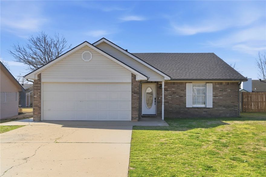 Welcome home to this charming 3-bedroom, 2-bath gem in a prime Rogers location! Step inside to a wide entryway with a coat closet that opens to a warm, inviting living room featuring a wood-burning fireplace and ceiling fan. The cute kitchen offers an electric range, pantry, breakfast nook, and a refrigerator that conveys. A dedicated laundry room with washer and dryer that also convey adds everyday convenience. The primary bedroom boasts a beautiful tray ceiling, walk-in closet, and a private en-suite with double sinks and a step-in tub. Both secondary bedrooms include walk-in closets, served by a full hall bath. Enjoy the spacious fenced backyard with a concrete patio and storage area — perfect for relaxing or entertaining. Brand new roof (approx. 1–1.5 years). 2-car garage. Minutes from shopping, restaurants, a movie theater, and nearby walking and biking trails. Move-in ready with great bones in a hard-to-beat location!