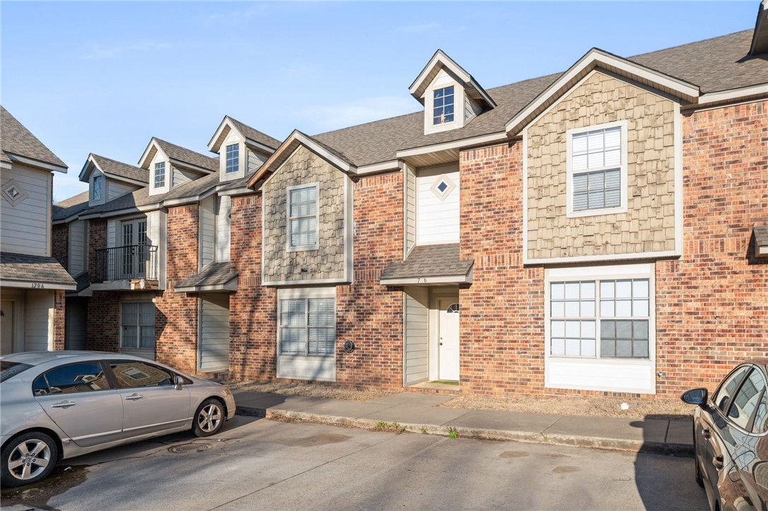 ***Back on market due to no fault of seller*** Nestled in a prime location near the University of Arkansas, this freshly painted and beautifully updated 3-bed, 2-bath condo offers the perfect blend of comfort and convenience. Recently refreshed, the home features hardwood floors in the living areas and plush carpet in the bedrooms, complemented by tile flooring in the kitchen and wet areas. A new HVAC system was installed in 2024, ensuring you stay comfortable year-round. The home has been thoughtfully updated throughout, providing a modern feel while retaining its cozy charm. Enjoy the outdoors with easy access to the picturesque Fayetteville walking trails just steps from your front door. You’re also within walking distance to a variety of local restaurants and shops, making it a breeze to explore the best of Fayetteville. Whether you're a student, a professional, or simply looking for a cozy place to call home, this condo offers an unbeatable location and all the amenities you need for a relaxed, easy lifestyle.