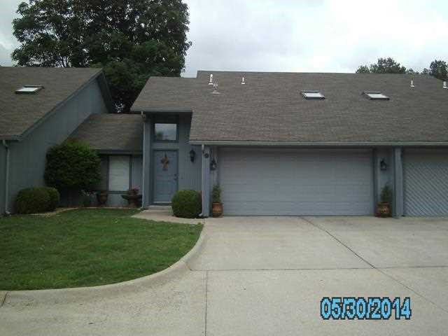 Townhouse in established area or Rogers. Central location. 2 car garage.