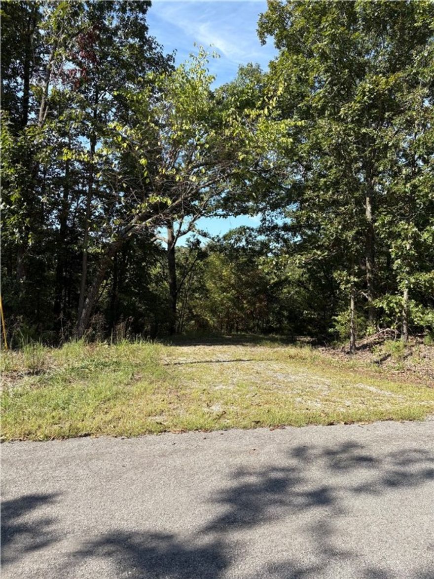 Rare opportunity to own a hard-to-find double lot totaling 1.45 acres in a peaceful cul-de-sac, perfectly situated near Lake Windsor and just minutes from Bella Vista’s popular bike trails. This spacious property backs up to POA green space, offering added privacy and a natural buffer, no rear neighbors! Located in one of the most desirable areas of Bella Vista, this lot is ideal for building your dream home, or vacation retreat. With mature trees and easy access to nearby recreational amenities, it strikes the perfect balance between seclusion and convenience. Enjoy all the benefits of Bella Vista living, including seven private lakes, multiple golf courses, scenic parks, and a welcoming, active community.