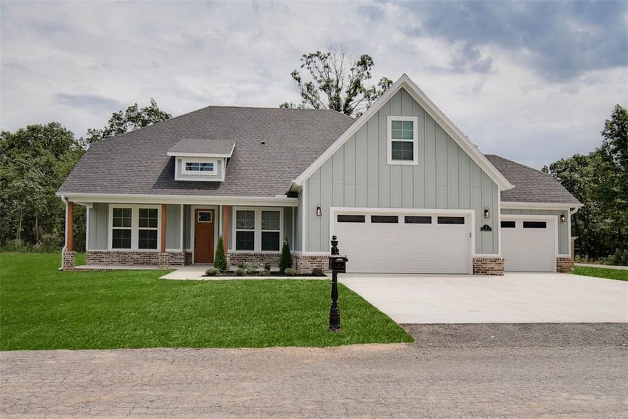 New construction on a flat .39 acre lot directly on trail! Located a few minutes from Lake Ann and Metfield Golf Course. Featuring a spacious 3-car garage, 3 bedrooms + upstairs bonus room with full bath. The kitchen is equipped with a large island, floor-to-ceiling cabinets, 3 cm quartz counters, custom cabinets, stainless steel appliances, and a gas range. The living room boasts a beautiful fireplace, exposed beams, a stunning cathedral ceiling, and hardwood floors which also extend into the primary bedroom. The primary bath features a luxurious soaking tub, separate vanities, and a huge walk-in closet with a custom tile shower. High-end finishes throughout. Bentonville schools. $3,500 in closing costs when using the builder's preferred local lender. Home is under construction. Front exterior will be painted Illusive Green (Sherman Williams). Approx completion date - 12/1/25