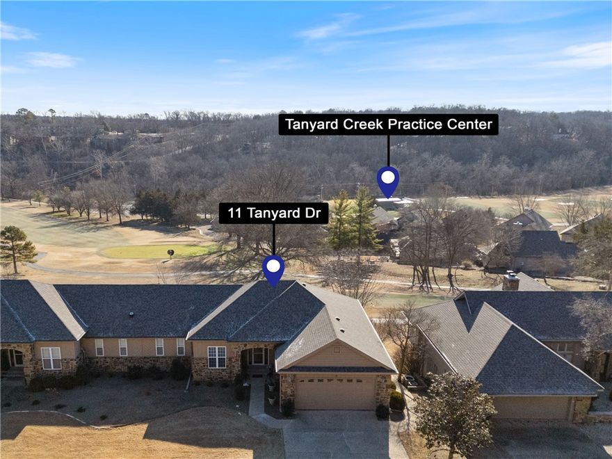GOLF FRONT 3600 square feet 2 level Townhouse, right above the new Tanyard Creek Practice center in Bella Vista.  This home is rare in that Townhomes in Tanyard seldom hit the market, rare in the that unit is over three thousand square feet with 2 floors directly on 8th hole, you can go for the hole in 2 shots on the par five below.  In golf talk with the New Tanyard practice center with lessons, practice, simulation, adult beverages, it's pretty dang cool for NWA,  located right below.  Tanyard Creek nature area with hiking, biking and rapids right next door too.  With the four bedrooms on sewer this lovely turnkey home is perfect for full time, or even vacation rentals.  The view off the top deck is unparalled and the floorplan is perfect for guests, a great entertaining home. You dont have to be Tiger Woods to see that this place is all things Golf just get out your clubs, hit the course and then Apres golf after right on the deck.