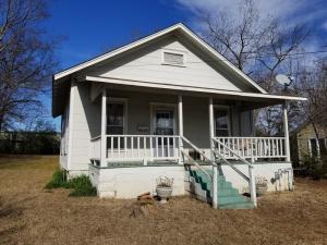 Neat cottage home with lots of potential. Has a good tenant in place that would love to stay, or move in and turn it into your dream home. Nice covered front porch and lots of old fashioned charm!