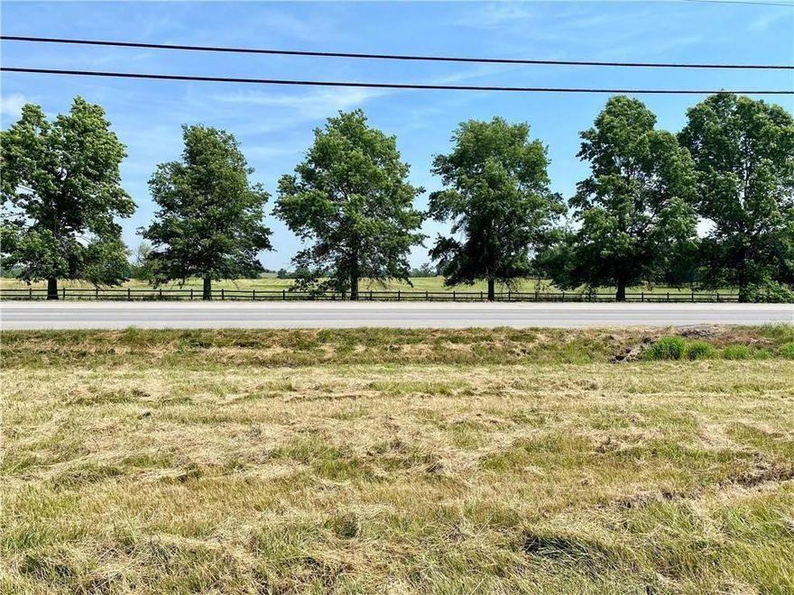 Major road frontage leading into Siloam Springs. A little more than 1 acre beside this tract which is currently under contract with major national chain. This tract is adjoining to the back portion (2.5 acres) which creates an L shape.