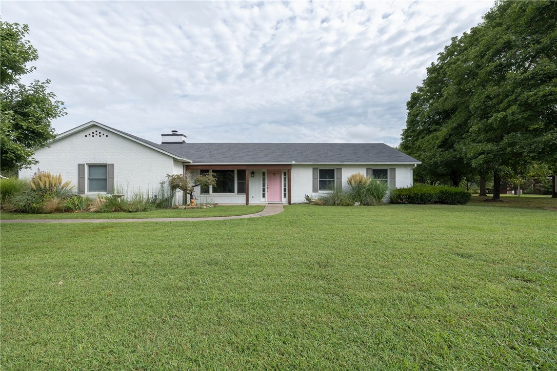 This property sits on one of the coveted lots adjacent to parkland, offering a wonderfully scenic setting with a back patio to enjoy it. The kitchen features a gas range, a brand-new dishwasher, and a counter-depth refrigerator. To one side of the kitchen is a dining room, and on the other, a hearth room with a wood-burning fireplace and an Andersen door that opens to the back patio. At the front of the home, youāll find a spacious living room. The original two-car garage has been converted into a bedroom along with an additional smaller room, ideal for an art studio or office. The primary ensuite, two bedrooms, and a full bath are located on the opposite end of the home. Just off the hearth roomāand near the side door that leads to the detached garageāyouāll find a convenient half bath and laundry area. From its versatile living spaces to its scenic surroundings, this home delivers a lifestyle as inviting as its location.