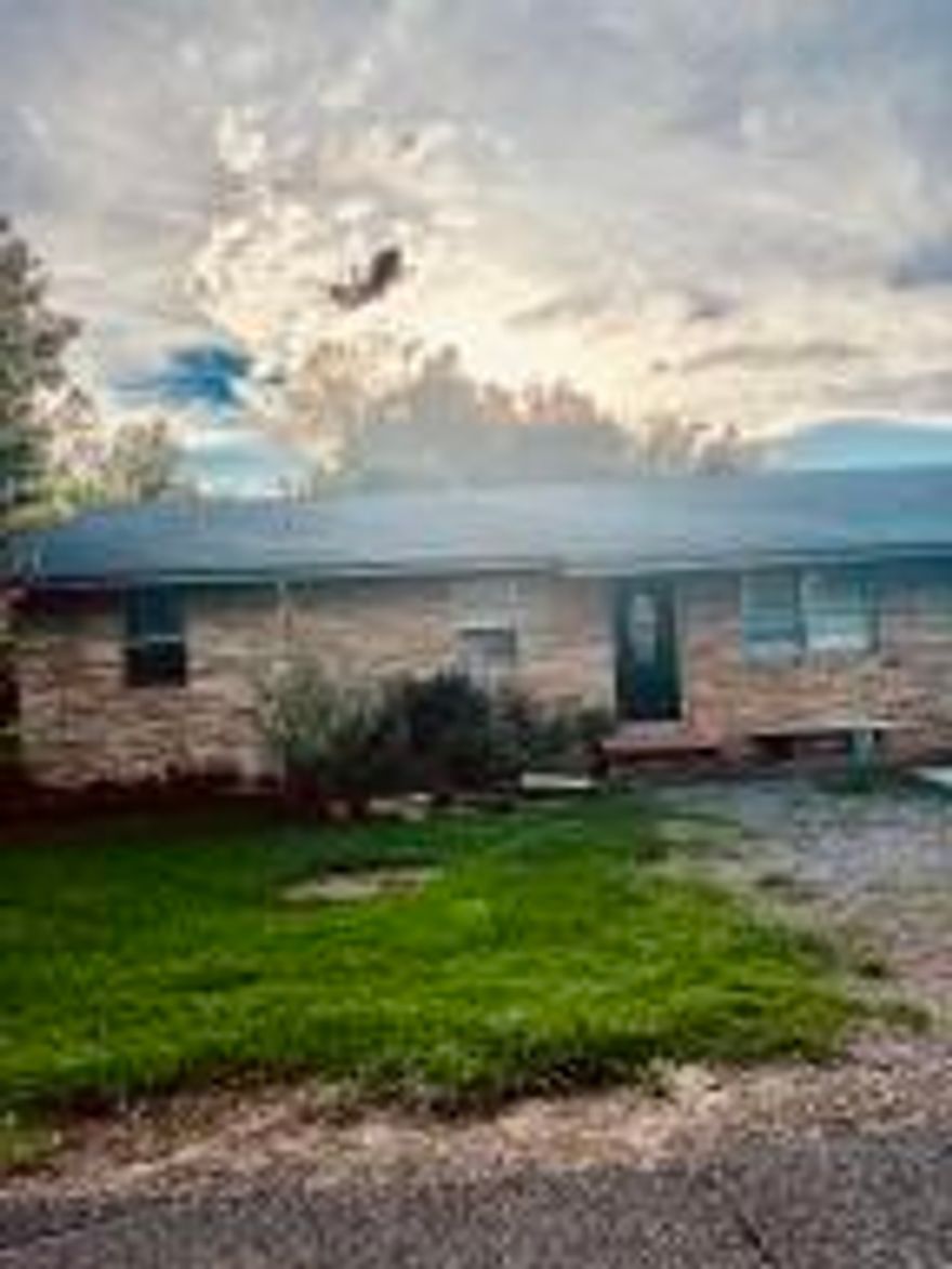 3 Bedroom house  with enclosed garage for 4th bedroom. It has a chain linked fenced backyard and roof is less than 3 years old. Easy access to school, hospital and groceries stores. Owner Financing Available SOLD AS IS *