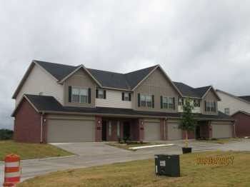 This spacious 3-bedroom, 2.5-bath townhome is located in a quiet fourplex community. Featuring an open-concept floor plan, modern kitchen, and private back patio, this home offers comfort and convenience at every turn. All three bedrooms are located upstairs, including a large primary suite with en-suite bath and walk-in closet. The home also includes a 1-car garage, in-unit laundry hookups, and easy access to shopping, dining, and major highways. Don't miss this opportunity to live in a desirable Rogers neighborhood—schedule your tour today! Lawn care provided.