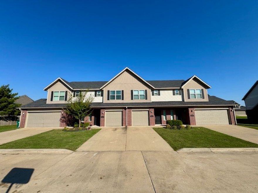 This spacious 3-bedroom, 2.5-bath townhome is located in a quiet fourplex community.  Featuring an open-concept floor plan, modern kitchen, and private back patio, this home offers comfort and convenience at every turn.  All three bedrooms are located upstairs, including a large primary suite with en-suite bath and walk-in closet. The home also includes a 2-car garage, in-unit laundry hookups, and easy access to shopping, dining, and major highways.  Don't miss this opportunity to live in a desirable Rogers neighborhood—schedule your tour today! Lawn care provided.