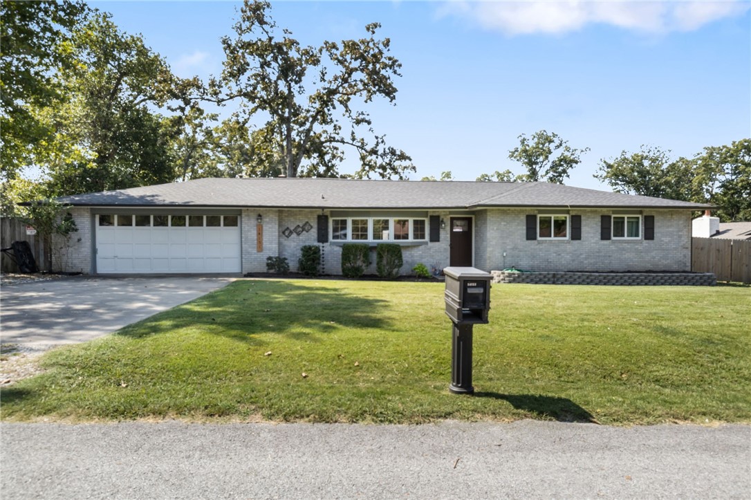 This beautifully updated 3-bedroom, 1.5-bath ranch-style home offers the perfect blend of comfort, style, and location. Just minutes from Beaver Lake and the Prairie Creek Marina, this move-in-ready gem is ideal for lake lovers or anyone seeking peaceful living with convenient access to town. Step inside to a spacious, light-filled living area featuring a stylish decorative fireplace and modern finishes throughout. The kitchen is both functional and inviting, with ample cabinet space, updated fixtures, and room for tasty treats! All bedrooms are sizable, and the refreshed bathrooms offer clean, contemporary appeal. Enjoy outdoor living at its best with a large backyard and a covered back porchāperfect for entertaining, relaxing, or enjoying quiet mornings. Whether you're looking for a full-time residence, a weekend retreat, or an investment opportunity, this home has it allāclean, charming, and close to everything you love about lake life. Roof is 6 years old. Windows and gutters replaced 2021. new dishwasher.