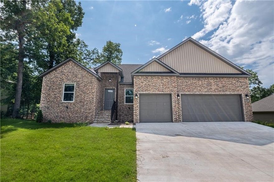 Great location, easy access to US 71. 4 Bedrooms and 3 Baths with the master bedroom and a second bedroom on the main level. This home has a 3 car garage and room to entertain. Open Kitchen with island and living area with fireplace. 2 bedrooms downstairs great for the family or for guest. Deck on the main level and a patio below from the downstairs. Entire home has been repainted!
