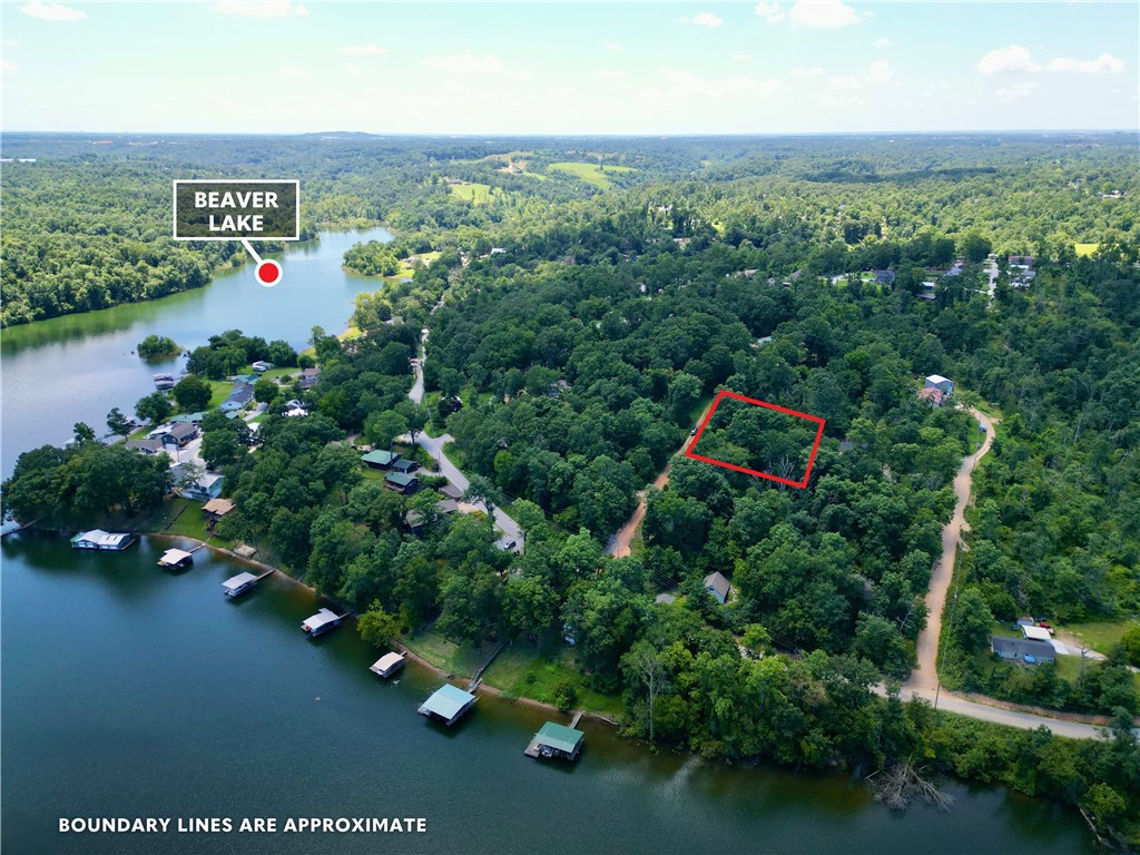 Dreaming of lake views and quiet serenity just minutes from city convenience? This buildable 0.46-acre lot on Villera Drive offers the perfect blend of natural beauty and accessibility. Nestled in a peaceful setting with a seasonal view of the Monte Ne arm of stunning Beaver Lake, this gently sloping lot is ready for your vision to take root. Conveniently located near Monte Ne Road, you're just a short drive to downtown Rogers, and moments away from the iconic Monte Ne Inn Chicken Restaurant — a local favorite. Whether you're planning a peaceful retreat or a modern masterpiece, let your imagination soar with the help of the creator behind Bentonville’s famous treehouse and the cliff house in Rogers. Collaborate to design and build your legacy home with views that inspire.0.46 acres – buildable & gently sloping, Seasonal views of Beaver Lake (Monte Ne side), Public water & electricity available at the street & septic system needed. This is more than land — it’s an opportunity to build your dream home!