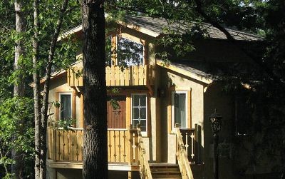 The Grand Treehouse Resort is a special place in Eureka Springs. Step into luxury at this stunning resort located in the heart of Eureka Springs. Contemporary studio style treehouses with raised walkways, hardwood floors, fireplaces, walk in showers, whirlpool tubs and chandeliers are just a few of the upscale features. The owner has thought of every little detail to make this a one of a kind stay for his guest. Walk to downtown shopping and restaurants, hop on the local trolley system or just cozy up in your room and enjoy the quiet peacefulness that The Grand Treehouse Resort brings. Incredible investment Property!