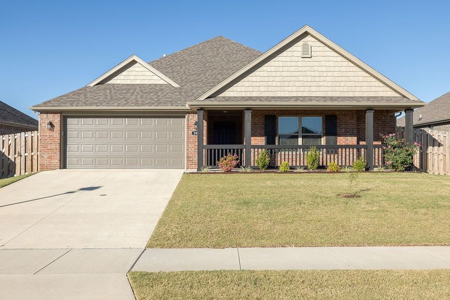 Move-in Ready Like-New barely lived-in 3/2/2 brick Home! Large front porch invites you into this 1 yr old home. Lovely split & open floor plan, fantastic island kitchen w/granite counters and pretty tile backsplash, large walk-in pantry, big walk-in closets, double vanity, soaker tub & walk-in shower in main bath, neutral (white) decor throughout! Pretty gas log fireplace in living room. Back porch is large and covered leading out to privacy-fenced back yard! No neighbor to the back of the house. Close to Walmart Neighborhood Market and Schools! Great front porch view of hills!
