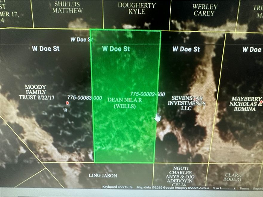 Wooded lot just off pavement, easy access to the lake or the golf course. Wooded, level and ready to build on.  Water and sewer accessible.