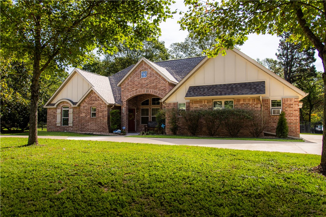 This immaculately maintained, move-in ready home was custom built in 2016. Enjoy the perfect blend of quiet living and unbeatable convenience. From the striking brick exterior and inviting red front door to the spacious covered porches, this home exudes charm and curb appeal. Inside, you’ll find gorgeous wood floors, large windows with plantation shutters, and an open-concept floorplan. Home is 2 Bed, 2 Bath and the kitchen features granite, stylish backsplash, gas cooktop, walk-in pantry, and a dedicated nook perfect for a home office. Cozy living room with pellet stove. Primary suite offers a peaceful retreat with a large walk-in closet, soaking tub, walk-in shower. Add. highlights include a freshly painted 2-car garage, ample paved parking, and a convenient half-circle driveway. New roof on home installed just last month! The park-like yard is fenced for pets and beautifully landscaped. This home offers timeless style, thoughtful features, and a fantastic location close to everything you need!