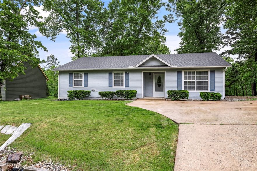 Charming 3-bed, 2-bath home just under 1,200 sq ft, set on a flat, usable lot with a low-maintenance concrete slab foundation. Inside, you’ll find fresh LVP flooring throughout—pet-friendly and completely carpet-free. The home features a spacious living area, a well-designed layout, and appliances that convey for added convenience. Recent updates include a new roof and attic fan in 2022. Step outside to a large back deck perfect for relaxing or entertaining, plus a handy storage shed for tools or hobby space. Whether you're searching for a starter home, downsizing, or looking for a solid investment property, this home offers comfort, practicality, and excellent value.